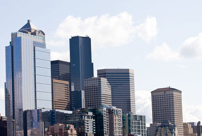 Skyscrapers in city against sky