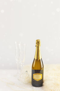 Close-up of champagne bottles on table