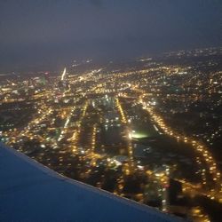 High angle view of illuminated city buildings at night