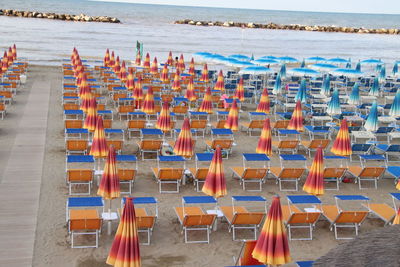 High angle view of chairs on beach