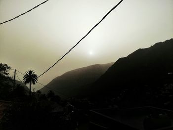 Scenic view of mountains against sky at sunset