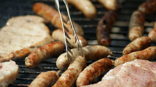 High angle view of meat on barbecue grill