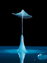 Close-up of water over black background