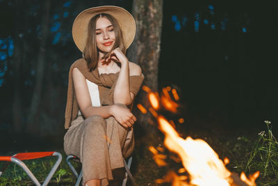 Young woman sitting in park