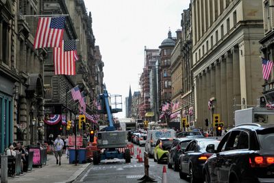 Street amidst buildings against sky in city