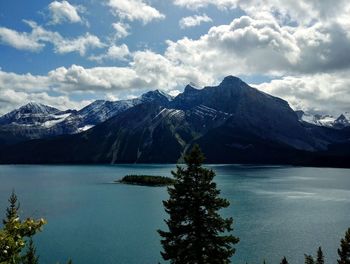 Scenic view of lake and mountains against sky