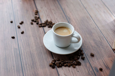 High angle view of coffee cup on table