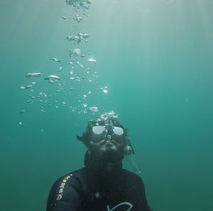 Portrait of man swimming in sea