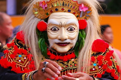 Close-up of person wearing costume and mask during traditional festival