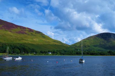 Boats sailing in lake