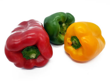 Close-up of bell peppers against white background