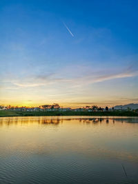 Scenic view of lake against sky during sunset