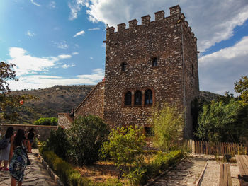 View of historical building against cloudy sky