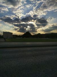 Scenic view of landscape against cloudy sky