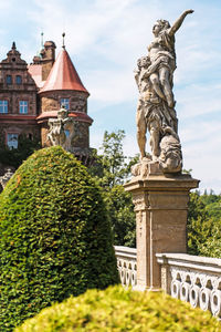 Statue of historic building against sky