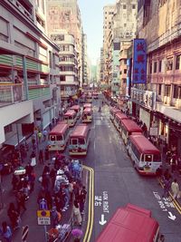High angle view of traffic on road amidst buildings in city
