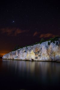 Scenic view of sea against sky at night