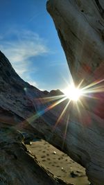 Sun shining over mountain