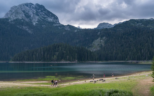 Scenic view of lake and mountains against sky