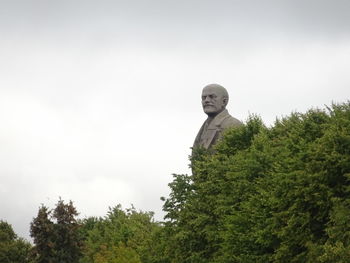 Low angle view of statue against sky