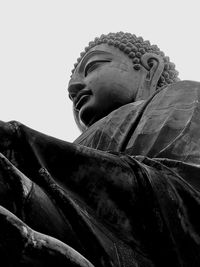 Low angle view of statue against sky