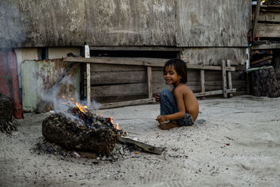 Portrait of girl sitting on floor