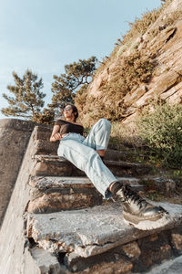 Full length of man sitting on steps