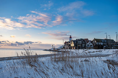 Scenic view of building during winter against sky