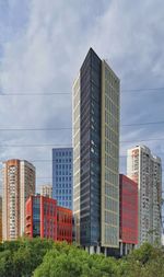 Modern buildings in city against sky