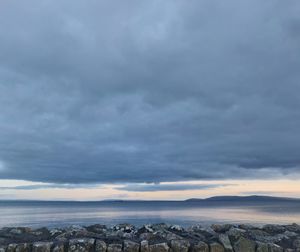 Scenic view of sea and rocks against sky