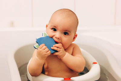 Portrait of cute baby girl at home