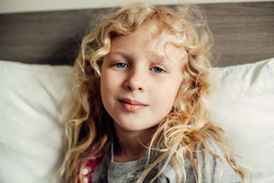 Portrait of cute girl on bed