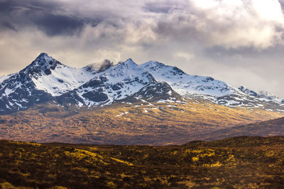 Scenic view of snowcapped mountains against sky