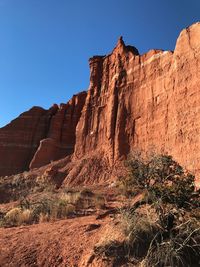 Rock formation on land against clear sky