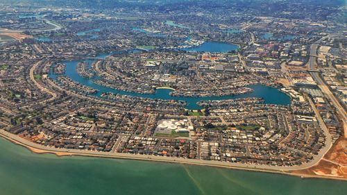 High angle view of buildings and sea in city