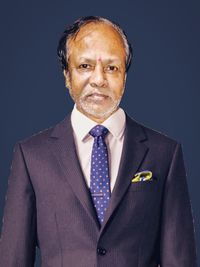 Portrait of businessman against blue background