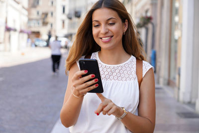 Young woman using mobile phone