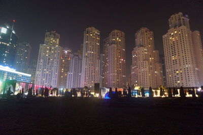 Illuminated cityscape at night