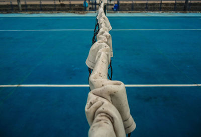 Low section of shoes on swimming pool