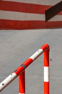 Close-up of red pipe on road