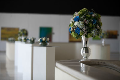 Close-up of flower vase on table at home