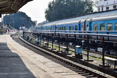 Indian railway train at amritsar railway station platform during morning time, colourful train