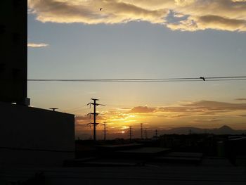 Silhouette of building at sunset