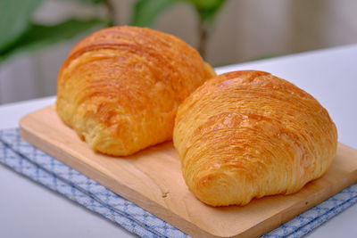 High angle view of bread on cutting board