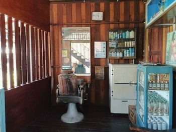 Empty chairs and tables in building