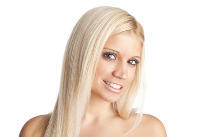 Portrait of a smiling young woman over white background