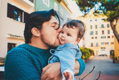 Portrait of father and daughter outdoors