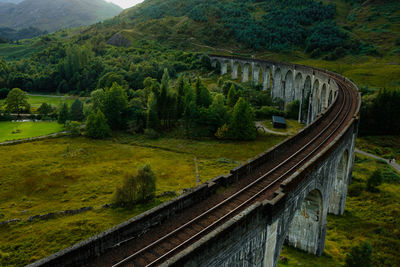 Glenfinnan historic rail viaduct in scottish highlands. full frame wide angle view in clouds day