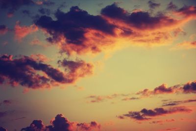 Low angle view of cloudy sky at sunset