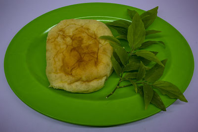 High angle view of fresh vegetables in plate on table